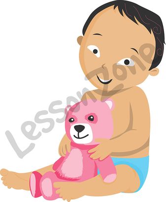 Baby boy holding teddy bear